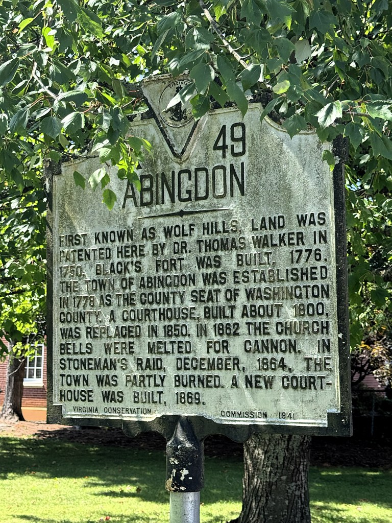 Historic marker for Abingdon, Virginia, detailing its origins, establishment, and significant events including the construction of buildings and the impact of the Civil War.